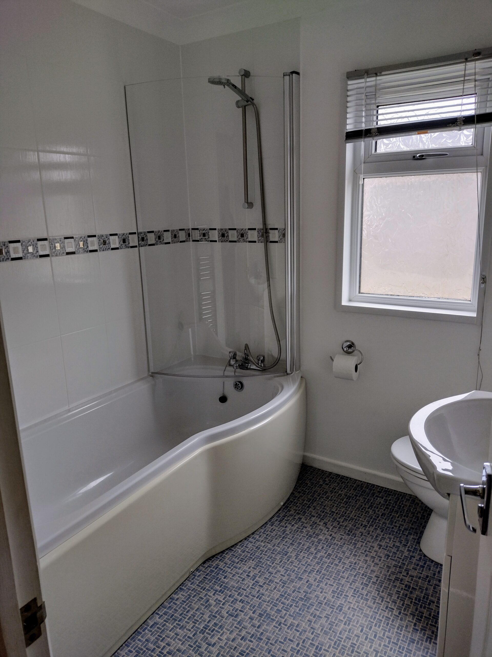 Apple Blossom family bathroom, with bath and shower over