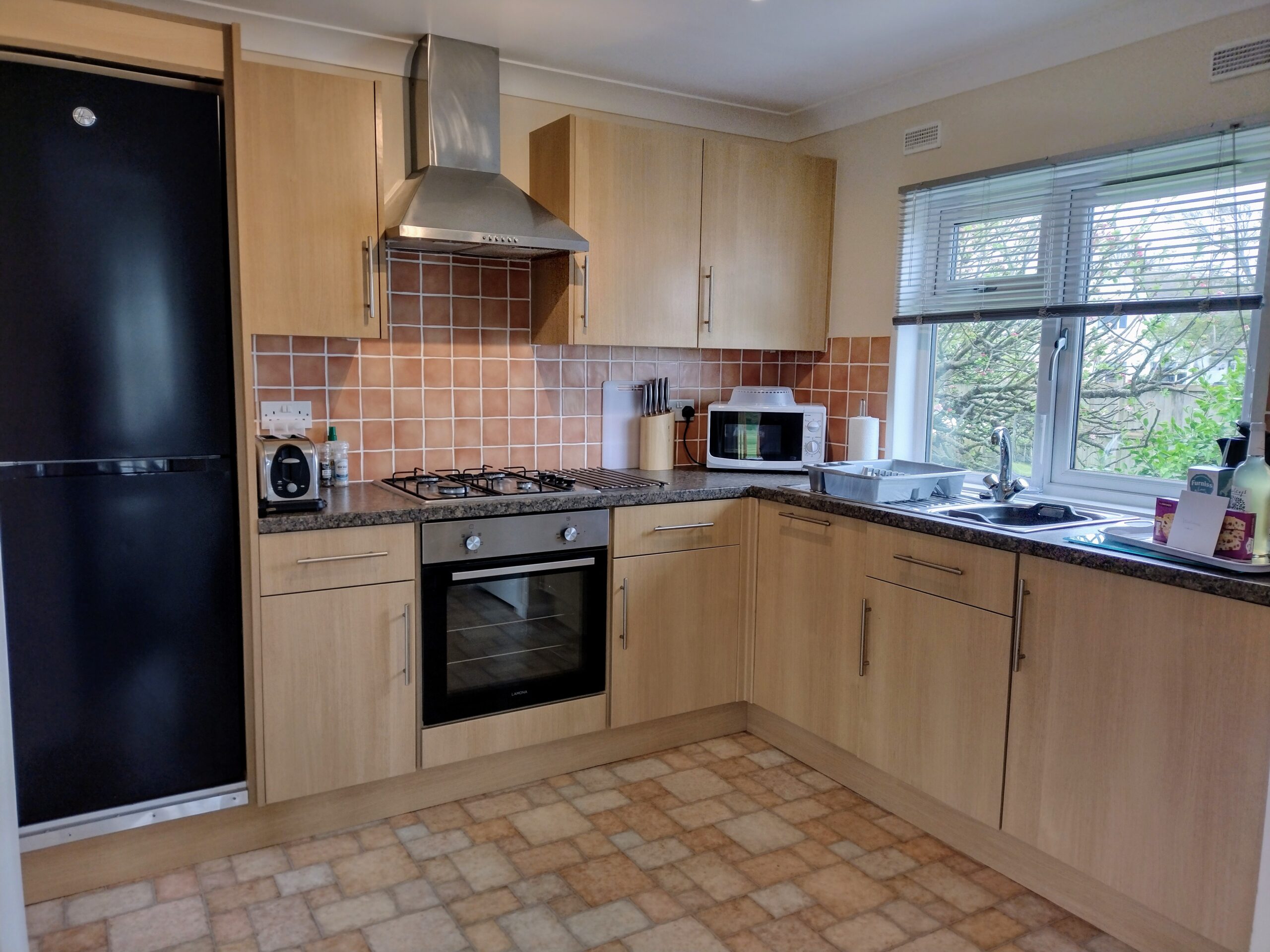Hawks Roost kitchen, with fridge, oven, hob and microwave